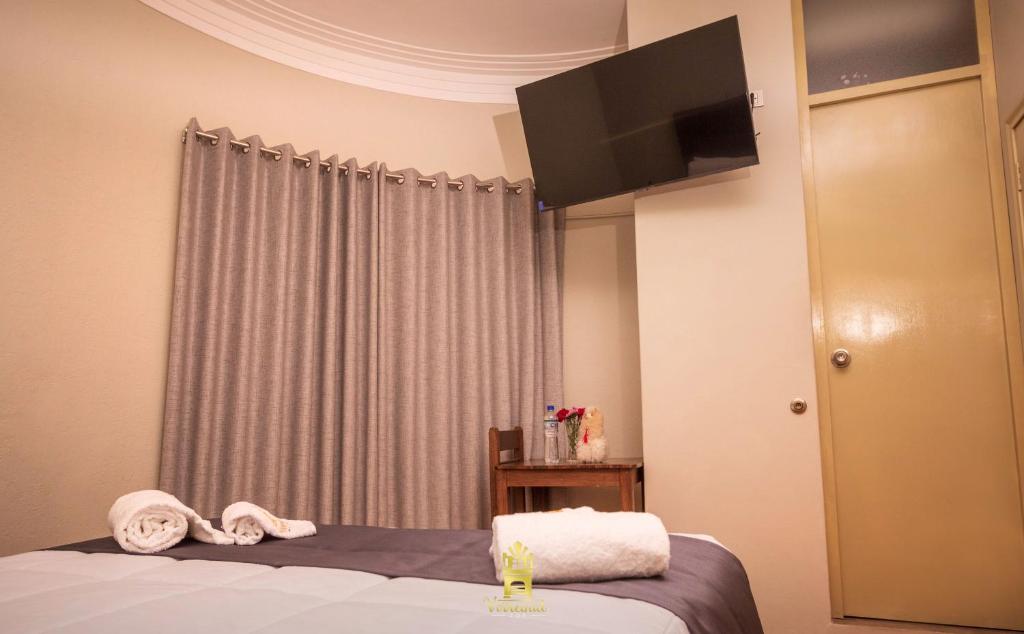 Postel nebo postele na pokoji v ubytování Hostal Virreinal AQP