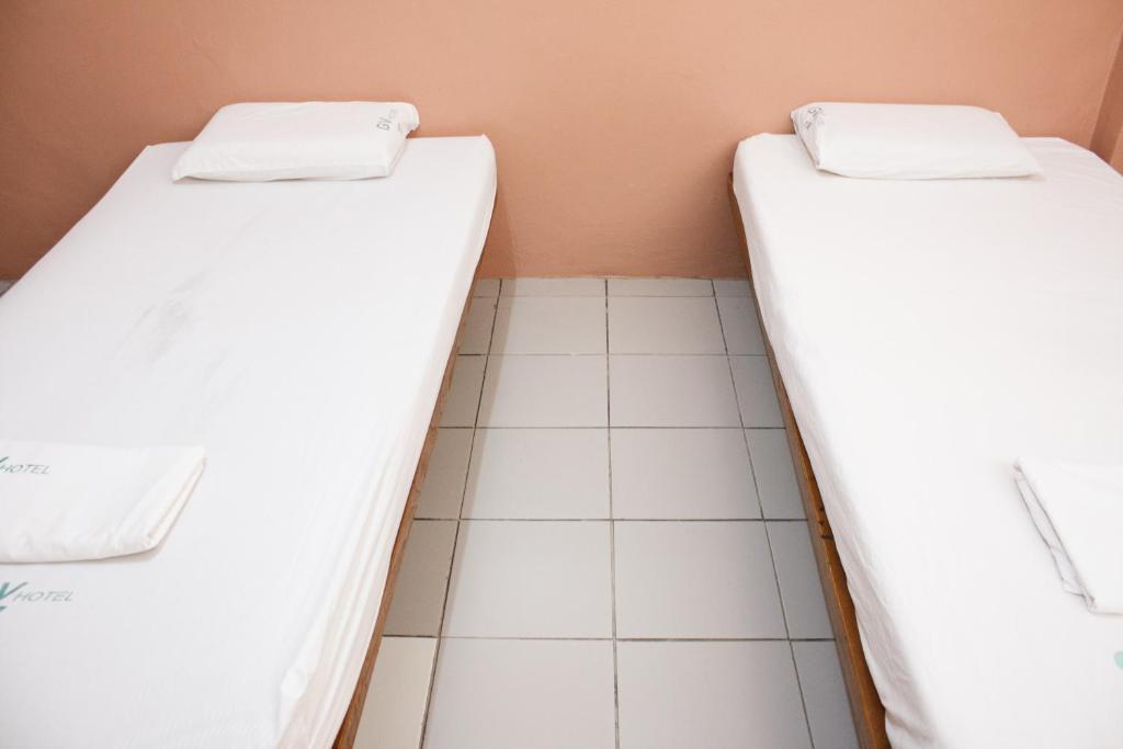 Postel nebo postele na pokoji v ubytování GV Hotel - Sogod