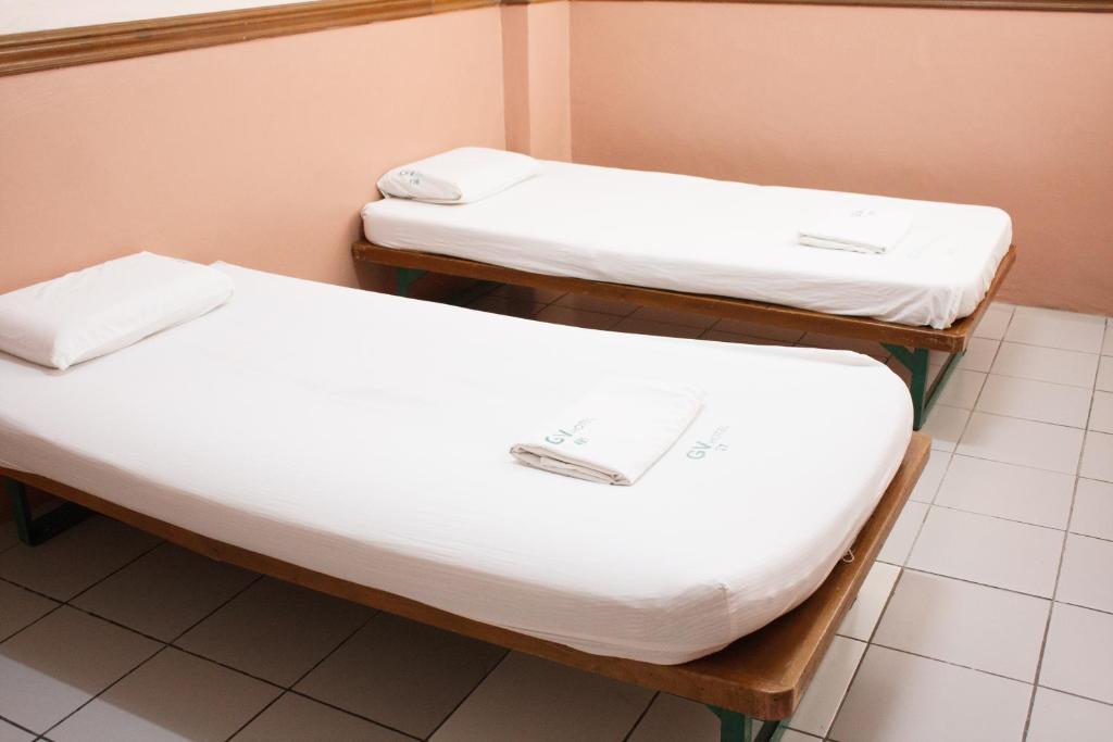 Postel nebo postele na pokoji v ubytování GV Hotel - Sogod
