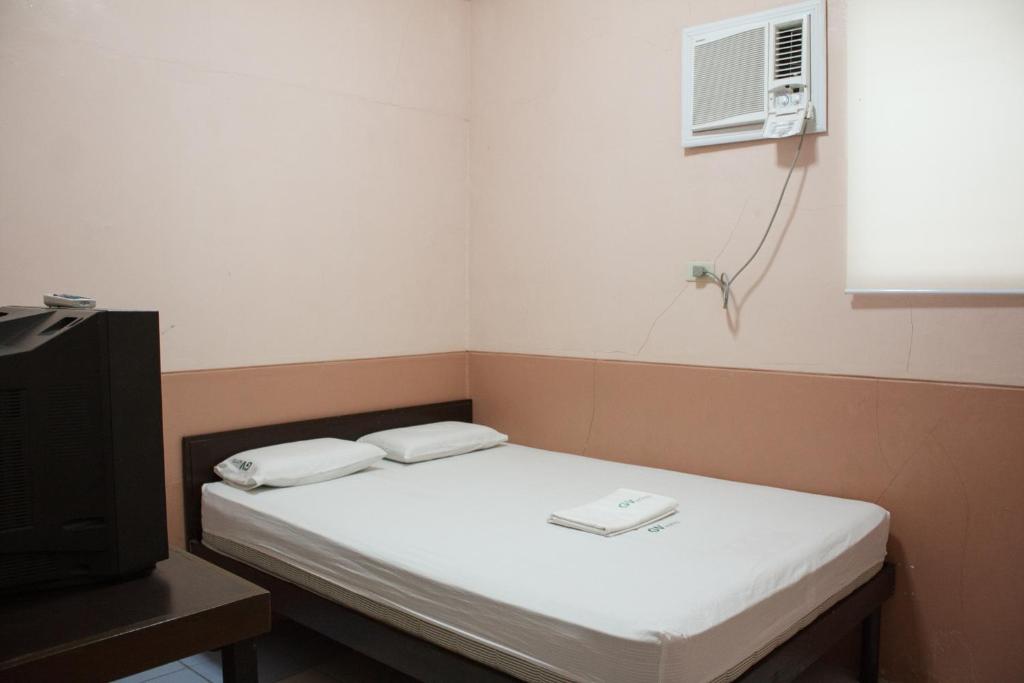 Postel nebo postele na pokoji v ubytování GV Hotel - Sogod