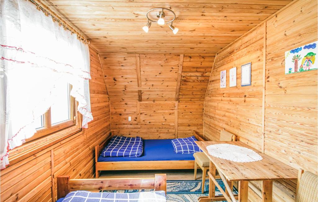 Posteľ alebo postele v izbe v ubytovaní Holiday Home Mragowo Czerwonki
