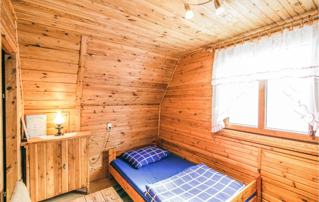 Posteľ alebo postele v izbe v ubytovaní Holiday Home Mragowo Czerwonki