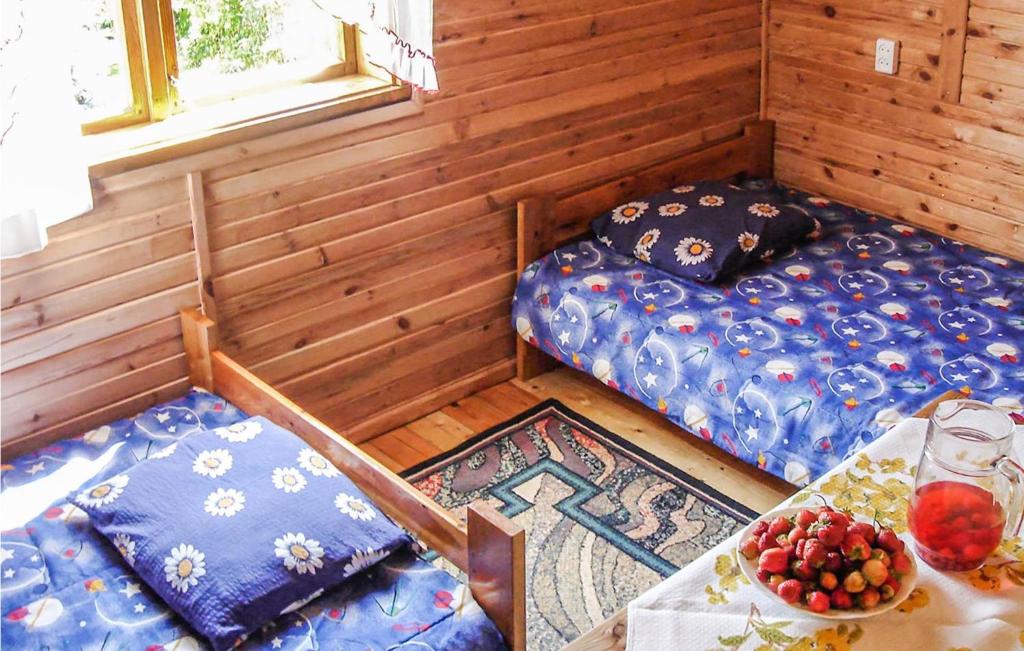 Posteľ alebo postele v izbe v ubytovaní Holiday Home Mragowo Czerwonki