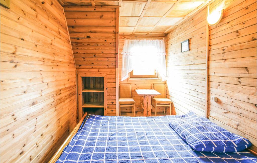 Posteľ alebo postele v izbe v ubytovaní Holiday Home Mragowo Czerwonki