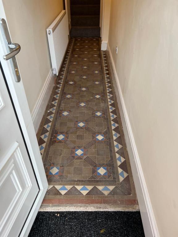 a hallway with a tiled floor in front of a door at Oak Dene in Doncaster