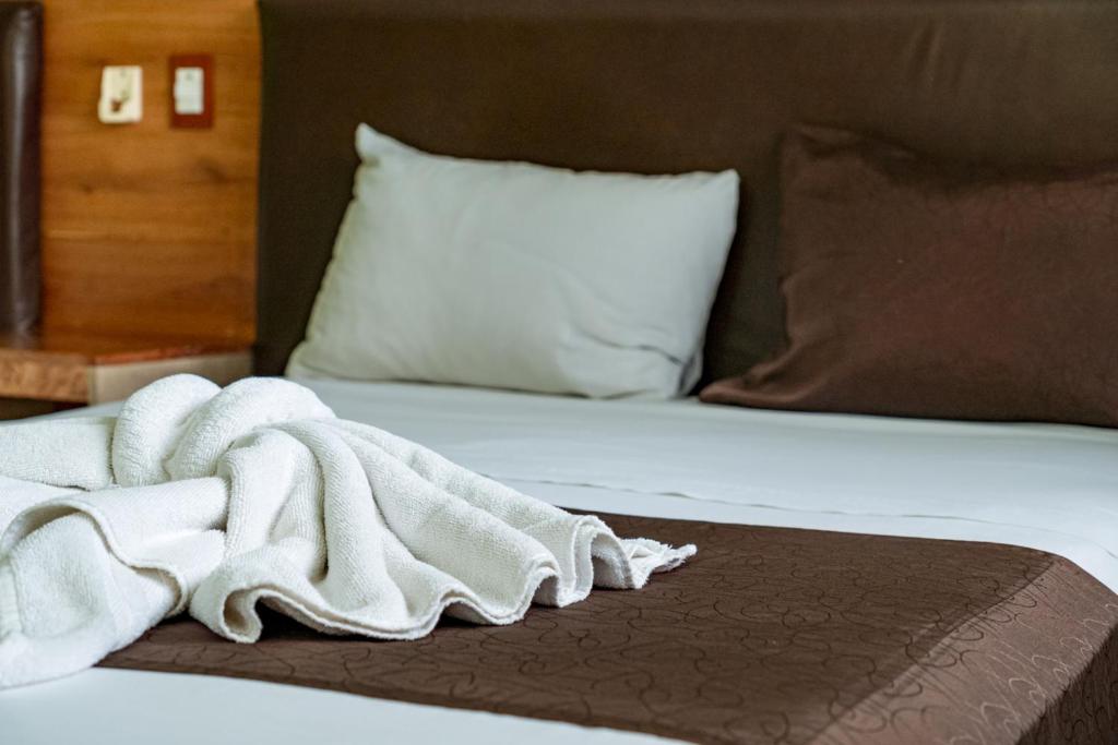 Postel nebo postele na pokoji v ubytování Hotel Cañada Internacional