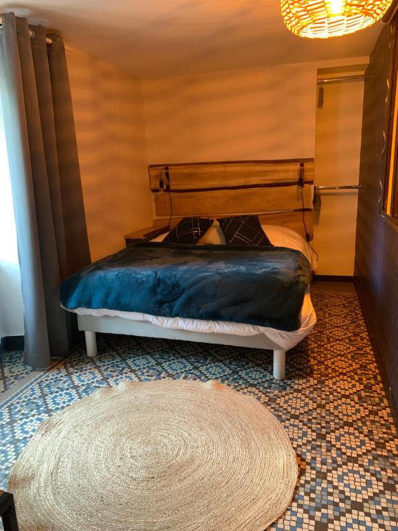 Łóżko lub łóżka w pokoju w obiekcie Gîte de la Couze pavin