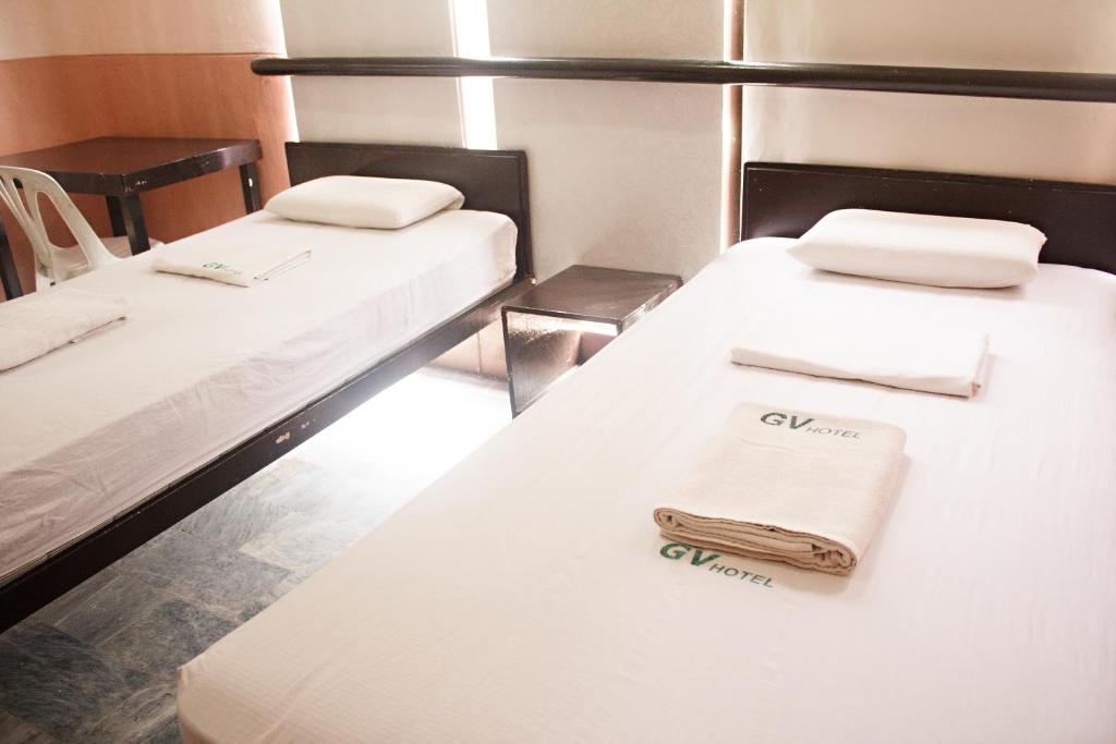 Postel nebo postele na pokoji v ubytování GV Hotel - Ormoc