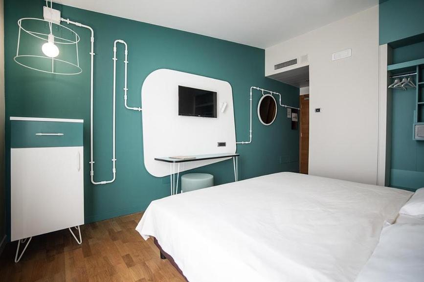 Postel nebo postele na pokoji v ubytování Hotel Corte Quadri