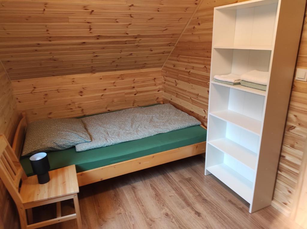 Postel nebo postele na pokoji v ubytování Domek na Blejchu