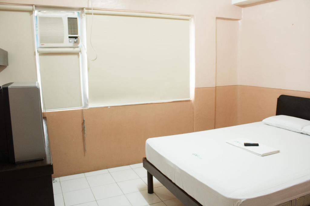 Postel nebo postele na pokoji v ubytování GV Hotel - Naval