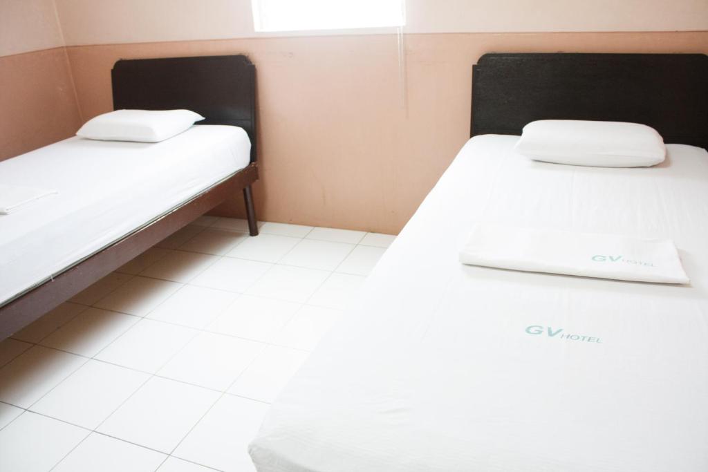 Postel nebo postele na pokoji v ubytování GV Hotel - Naval