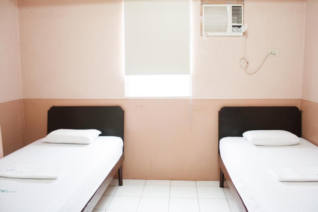 Postel nebo postele na pokoji v ubytování GV Hotel - Naval