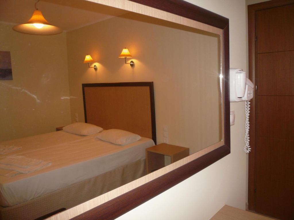Postel nebo postele na pokoji v ubytování Hotel Avra