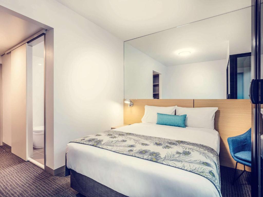 Postel nebo postele na pokoji v ubytování Mercure Darwin Airport Resort