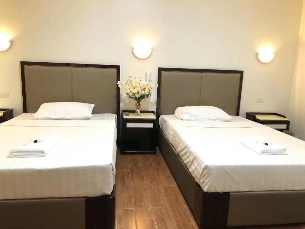 Postel nebo postele na pokoji v ubytování Meaco Royal Hotel- Aparri