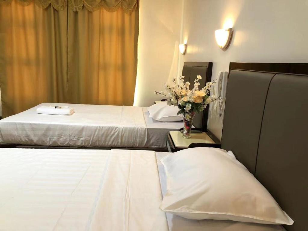 Postel nebo postele na pokoji v ubytování Meaco Royal Hotel- Aparri