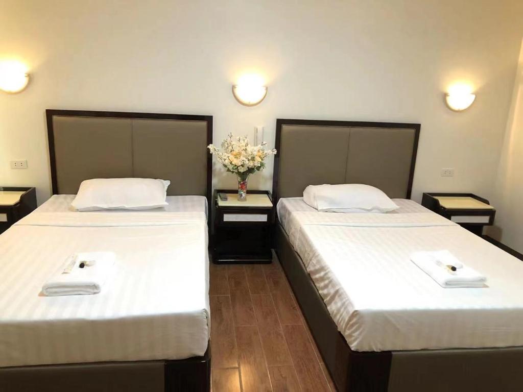 Postel nebo postele na pokoji v ubytování Meaco Royal Hotel- Aparri