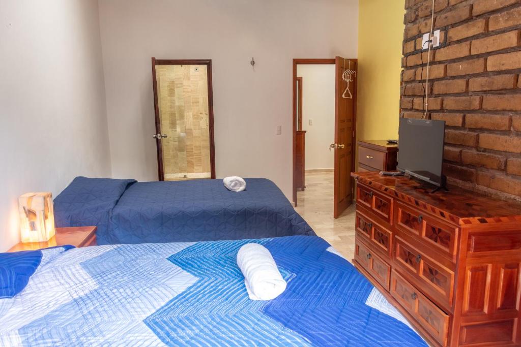 Postel nebo postele na pokoji v ubytování CASA ANTARES