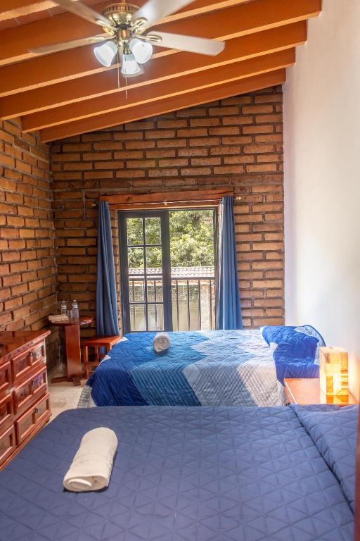 Postel nebo postele na pokoji v ubytování CASA ANTARES