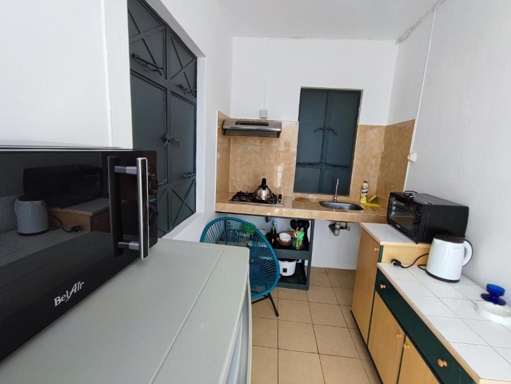 Kuchyň nebo kuchyňský kout v ubytování Ti Pavillon