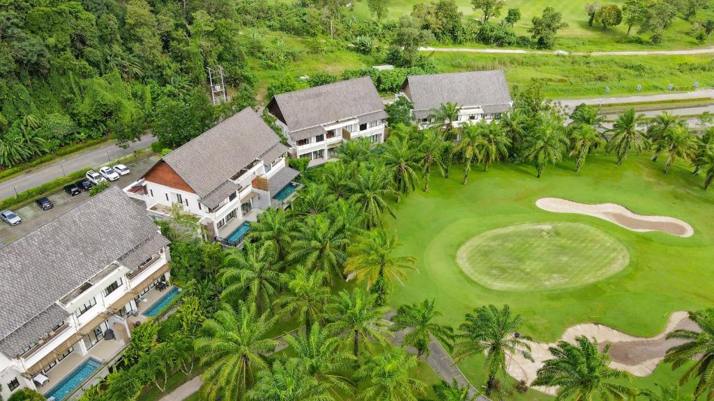 an aerial view of a resort with a golf course at Tinidee Golf Resort Phuket - SHA Extra Plus in Kathu