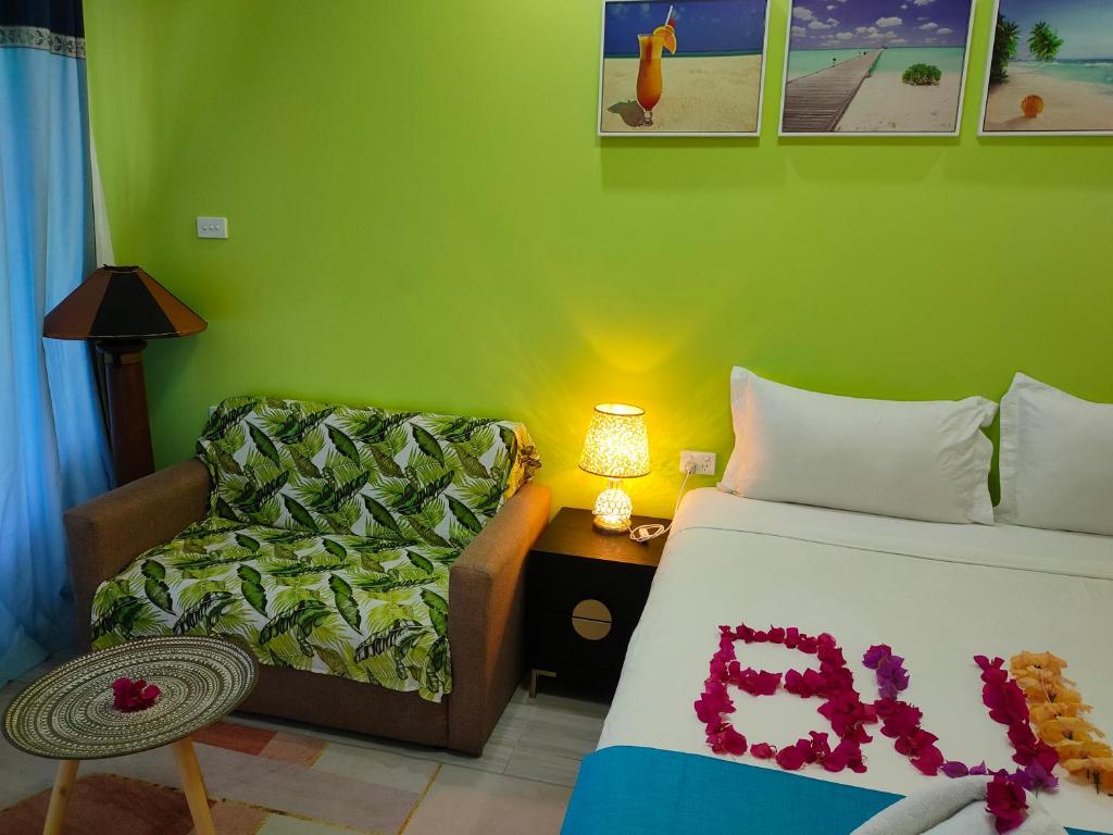 Llit o llits en una habitació de Nadi Fancy Hotel