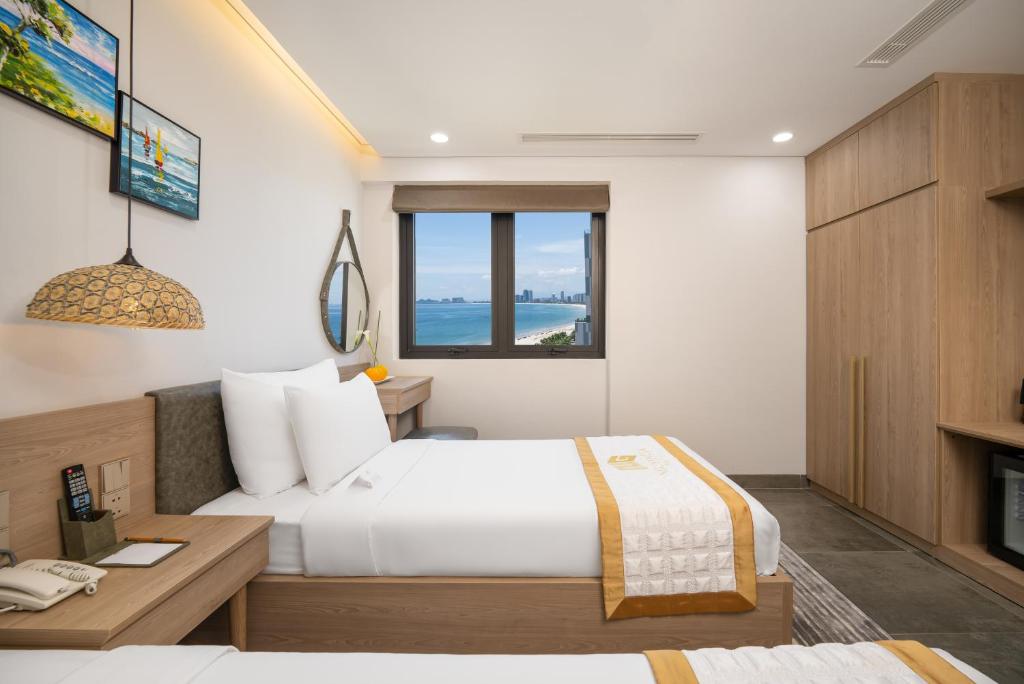 Postel nebo postele na pokoji v ubytování Nguyen Gia Hotel