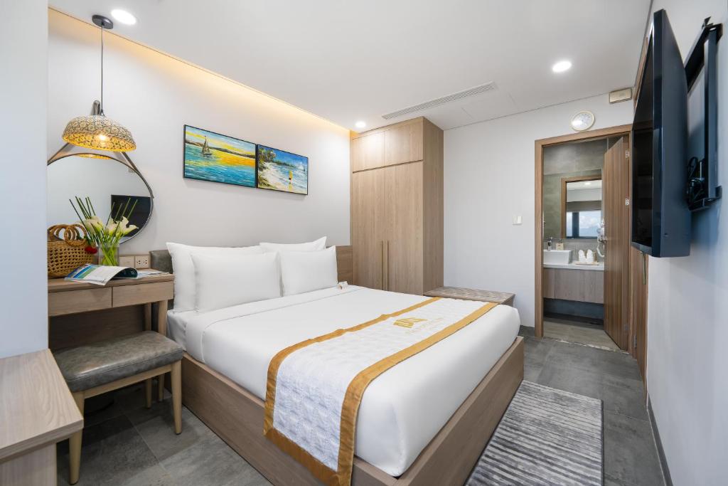 Postel nebo postele na pokoji v ubytování Nguyen Gia Hotel