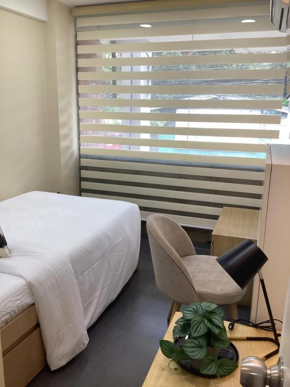 Postel nebo postele na pokoji v ubytování D' Residences