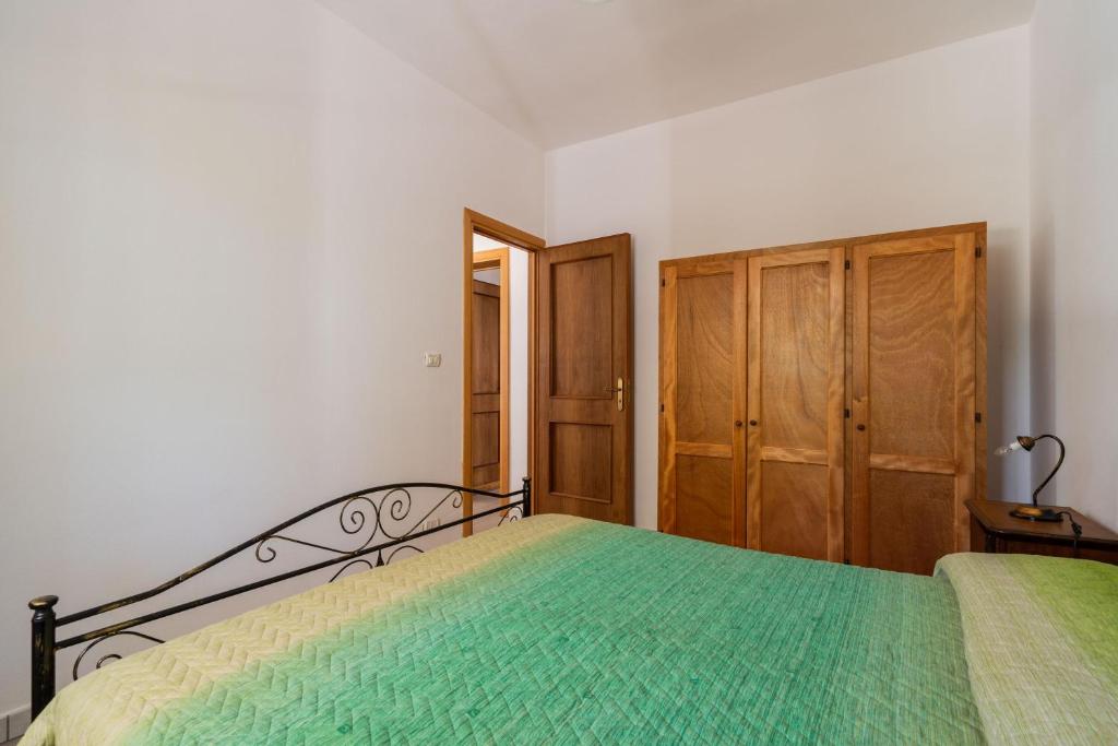 Łóżko lub łóżka w pokoju w obiekcie Tenuta La Saracina - Villino 1