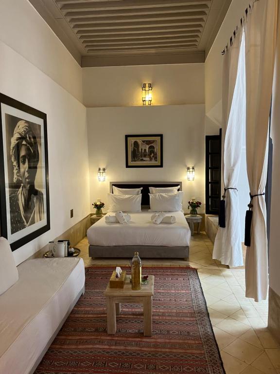 Postel nebo postele na pokoji v ubytování RIAD ENNAFOURA BOUTIQUE HOTEL