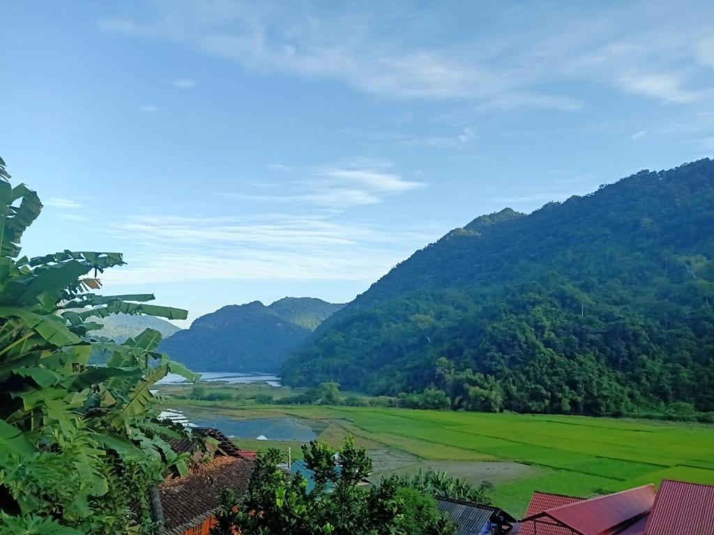 a view of a valley with a river and mountains at Ba Bể Green (View Ba Be lake) in Bak Kan