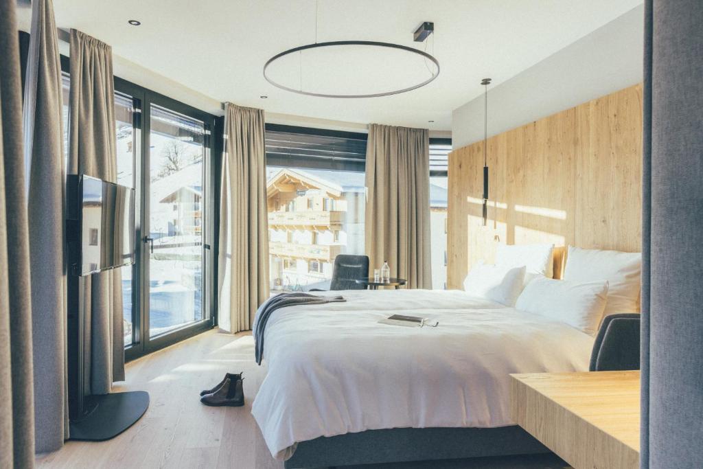 Postel nebo postele na pokoji v ubytování DAS GERLOS - Boutique Hotel