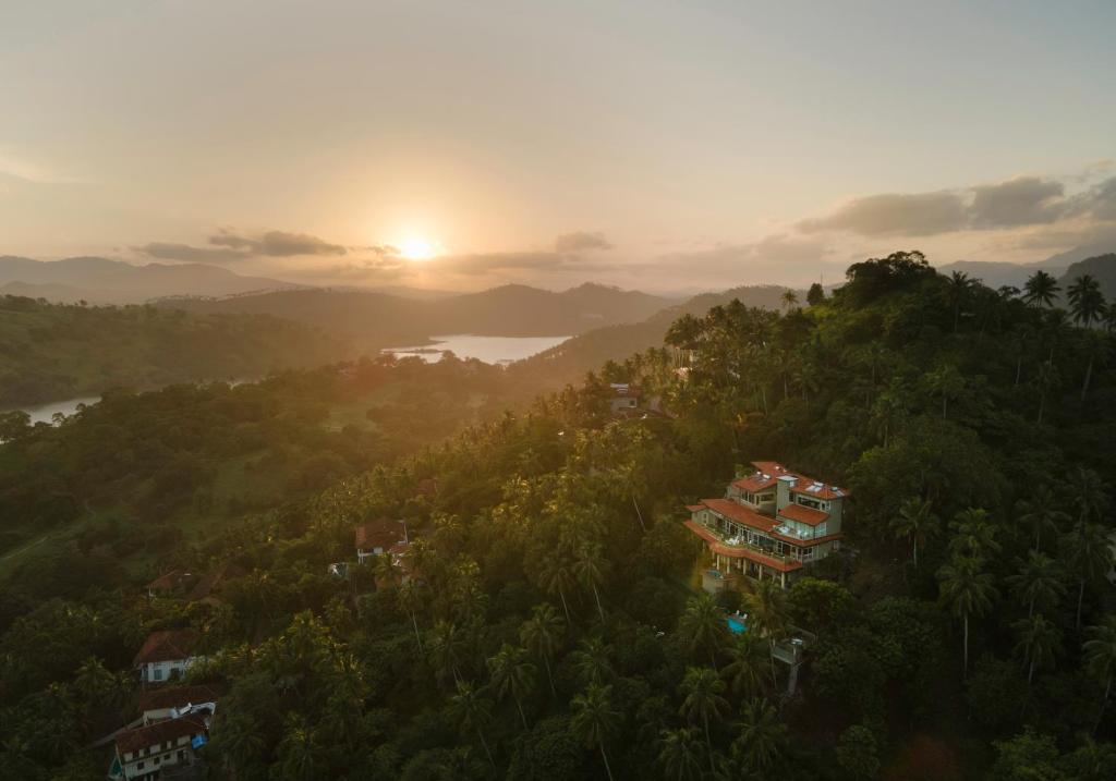 an aerial view of a house on a hill with trees at Albatross by The Clarks, Kandy in Digana