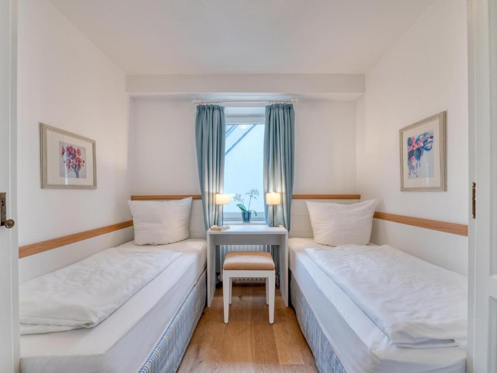 Postel nebo postele na pokoji v ubytování Appartement-Hotel Timmendorfer Strand