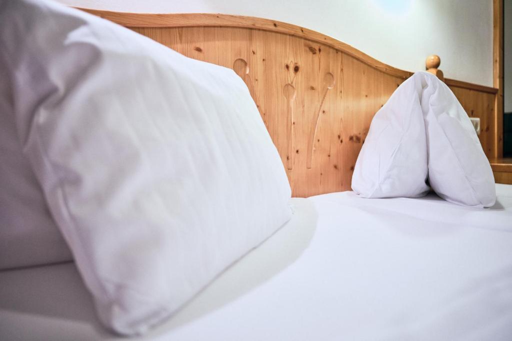 Voodi või voodid majutusasutuse Hotel Kirchboden by Alpeffect Hotels toas