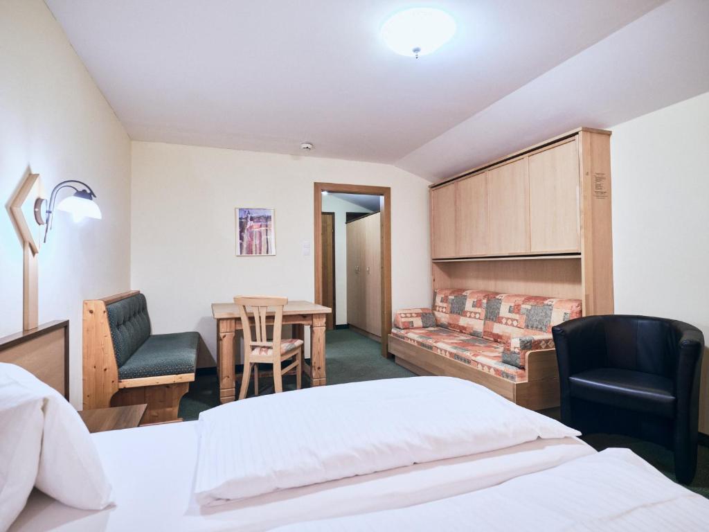 Voodi või voodid majutusasutuse Hotel Kirchboden by Alpeffect Hotels toas