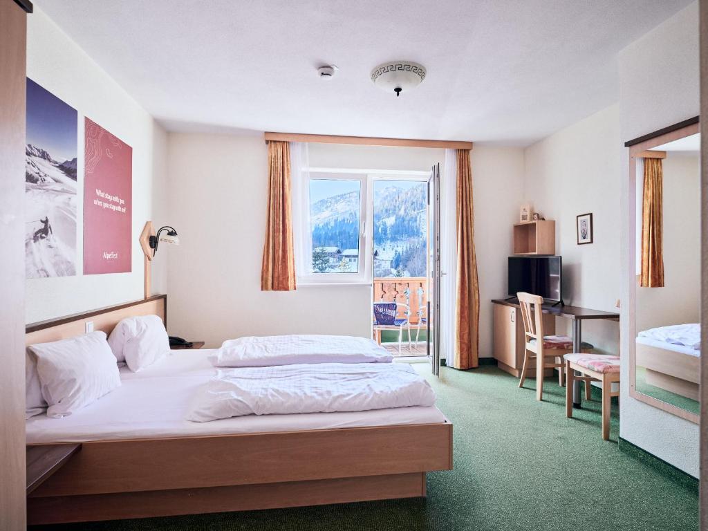 Voodi või voodid majutusasutuse Hotel Kirchboden by Alpeffect Hotels toas