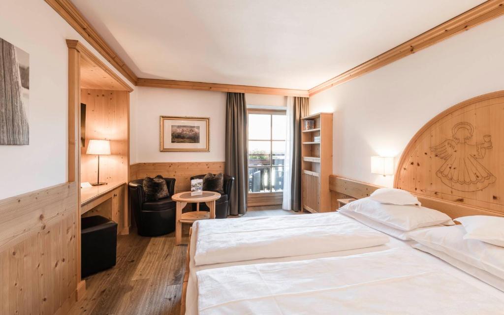 Postel nebo postele na pokoji v ubytování Hotel Angelo Engel