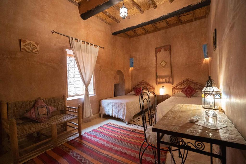 Postel nebo postele na pokoji v ubytování Dar Kamar