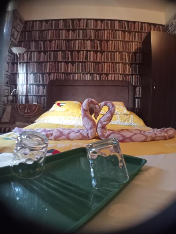 A bed or beds in a room at Jocó Panzió