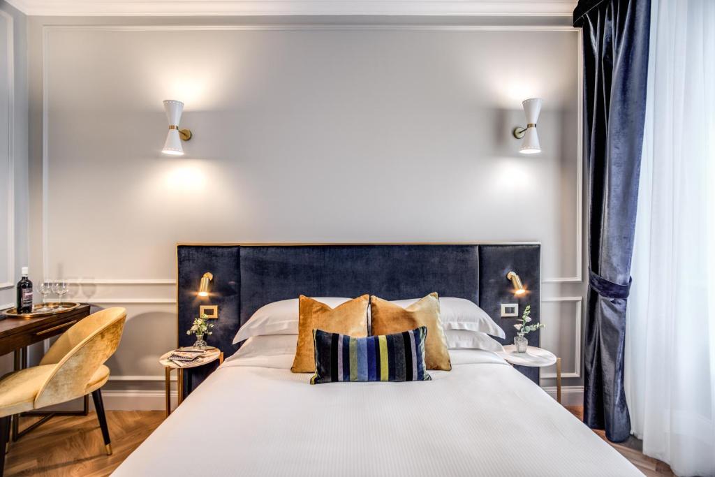 Postel nebo postele na pokoji v ubytování Tree Charme Augusto Luxury Suites