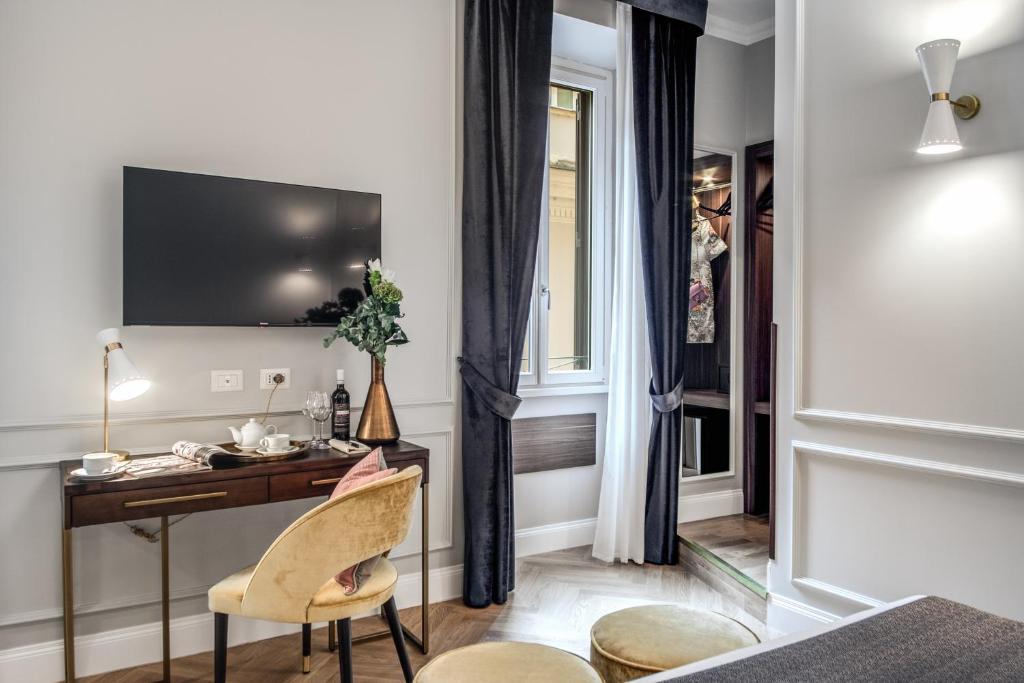 TV a/nebo společenská místnost v ubytování Tree Charme Augusto Luxury Suites