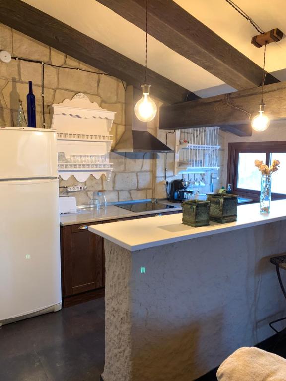 Kuchyň nebo kuchyňský kout v ubytování LA BUHARDILLA