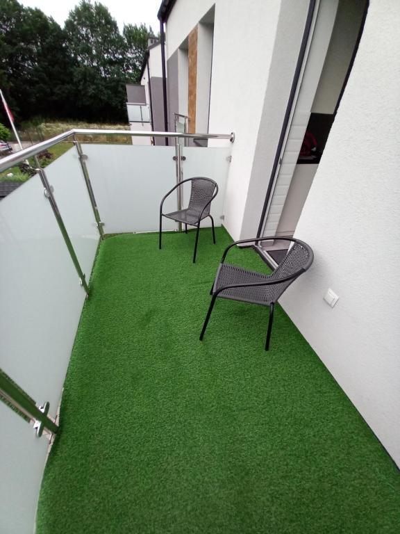 Vonkajšia záhrada v ubytovaní Apartament przy Obozie