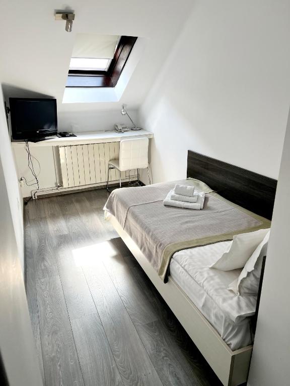 Postel nebo postele na pokoji v ubytování Garni hotel King
