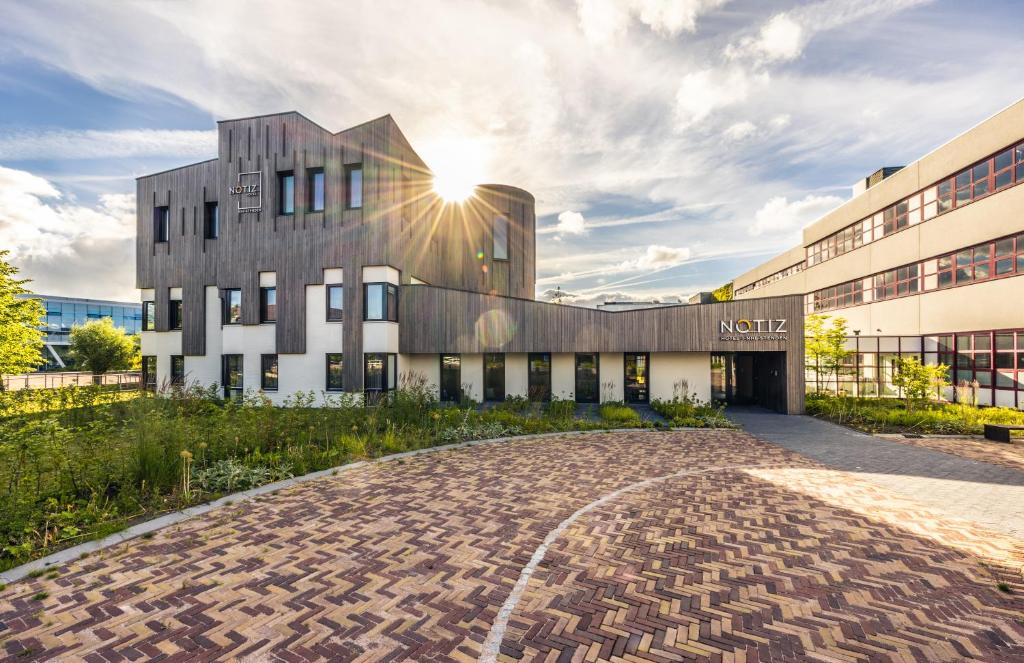 een weergave van de noordgevel van het noordelijke knooppuntgebouw bij Notiz Hotel Leeuwarden in Leeuwarden