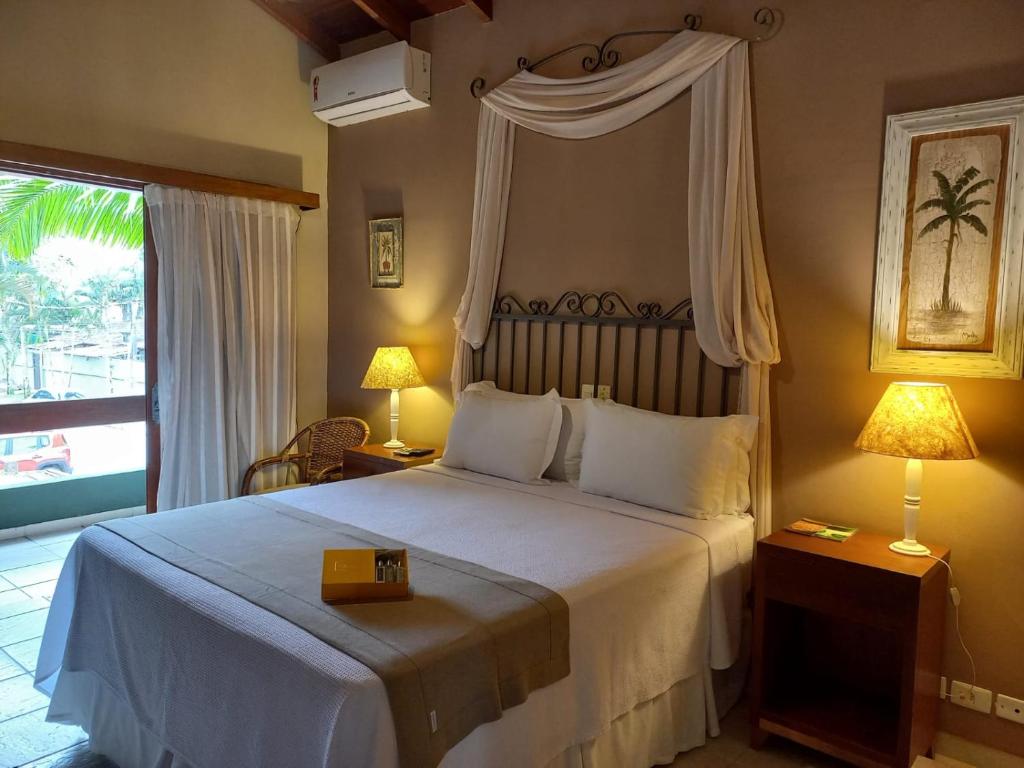 Cama ou camas em um quarto em Hiu Hotel