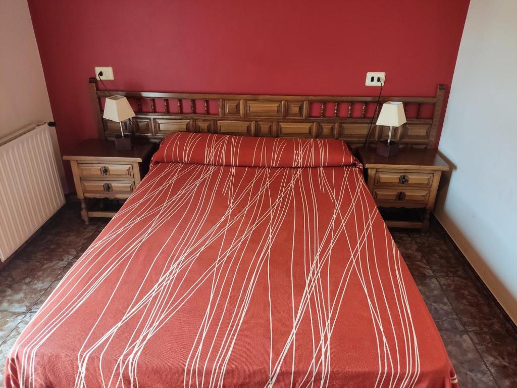 Łóżko lub łóżka w pokoju w obiekcie Hostal Las Vegas